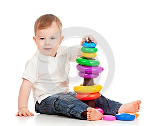 Child playing with color toy pyramidion