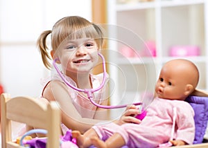 Child playing doctor role game examinating her photo