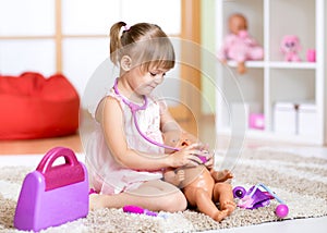 Child playing doctor with toy