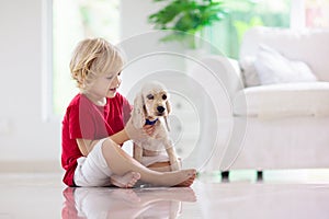 Child playing with dog. Kids play with puppy