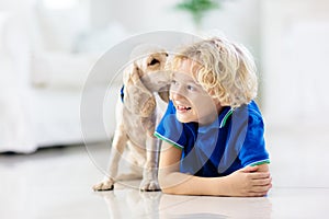 Child playing with dog. Kids play with puppy