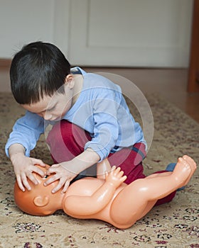 Child playing with doll