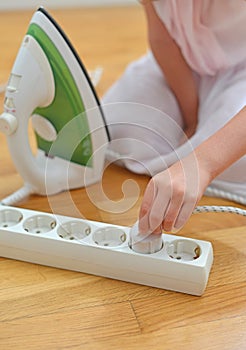 Child playing with electricity.