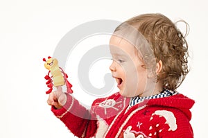 Child playing with finger puppet photo