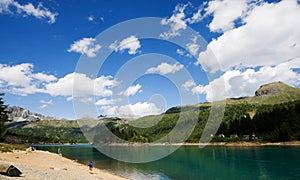 Child playing in front of devero lake photo