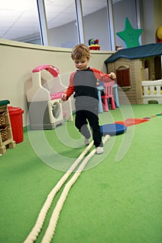 Child playing in game room