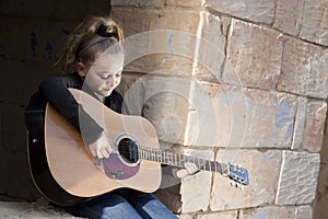 Child playing guitar