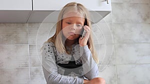 Child playing hand made toy called slime.