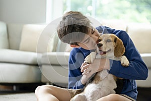 Child Playing With His Pet Dog At Home