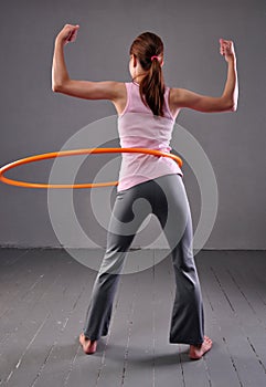 Child playing with hula hoop