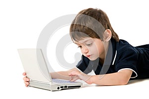 Child playing with the laptop
