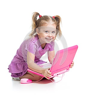 Child playing with laptop toy