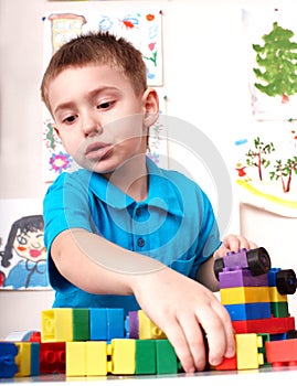 Child playing lego block and construction set.