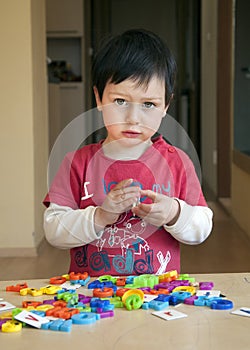 Child playing with letters