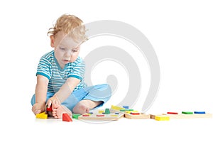 Child playing logical education toys with interest