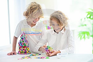 Child playing with magnetic building blocks