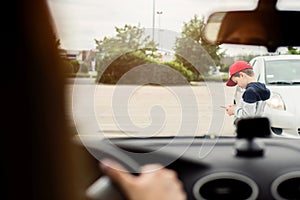 Child playing mobile games on smartphone on the street