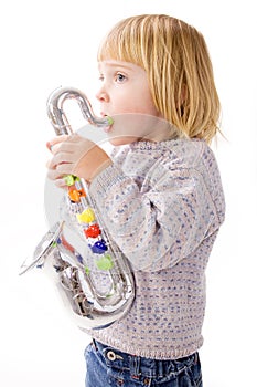 Child playing music on saxophone