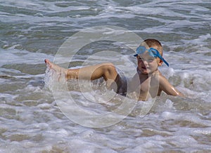 Child playing in the ocean