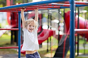 Child on playground. Kids play outdoor