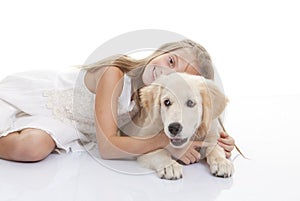 Child playing with pet dog