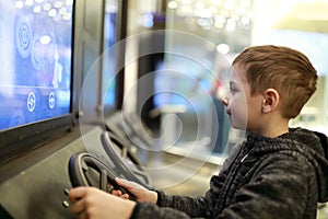 Child playing racing simulator game