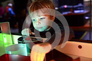 Child playing with refraction of light