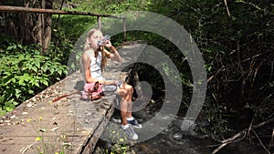 Child Playing by River Water, Kid at Camping in Mountains, Girl in Nature