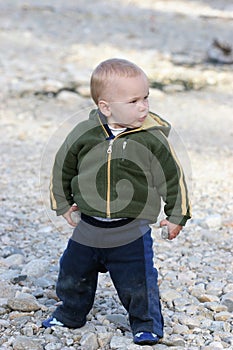 Child playing with rocks