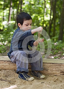 Child playing in sandbox