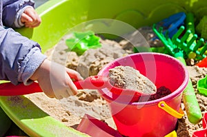 Child playing in sandbox