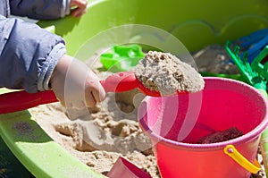 Child playing in sandbox