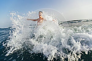 Child playing in the sea. Kid having fun outdoors. Summer vacation and healthy lifestyle concept. Selective focus
