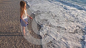 Child Playing in Sea Waves, Kid on Beach, Girl Running on Seashore in Sunset