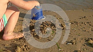 Child playing on seashore.