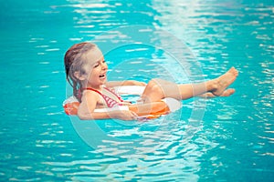 Child playing in swimming pool