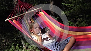 Child Playing Tablet in Hammock, Girl Relaxing in Forest, Wood, Outdoor View 4K