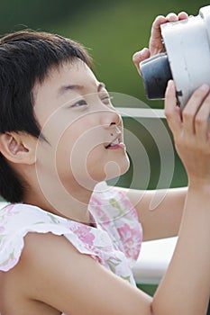 Child playing telescope