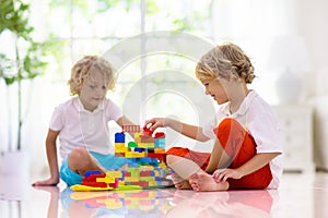 Child playing with toy blocks. Kids play