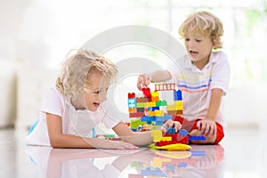 Child playing with toy blocks. Kids play