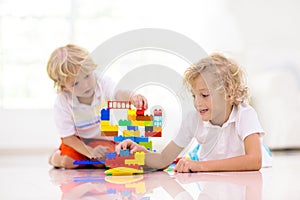 Child playing with toy blocks. Kids play