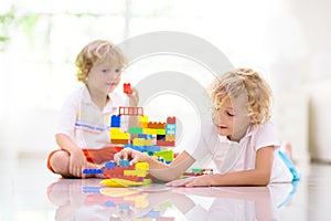 Child playing with toy blocks. Kids play