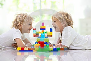 Child playing with toy blocks. Kids play