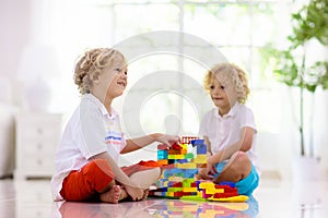 Child playing with toy blocks. Kids play