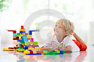 Child playing with toy blocks. Kids play