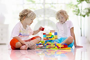 Child playing with toy blocks. Kids play