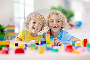 Child playing with toy blocks. Toys for kids