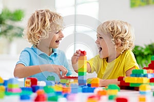 Child playing with toy blocks. Toys for kids