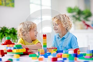 Child playing with toy blocks. Toys for kids