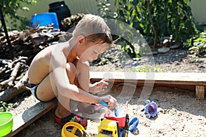 Child playing with toy car